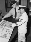Navy Recruiting officer M. A. Legros, right, and J. R. Shetter, a city policeman, who is to join Navy