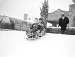 Ann Goodwin and Ralph Beaver riding on a sled