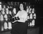 Ann Hutt looking at the trophies to be awarded to winners of the Texas Golden Gloves Tournament