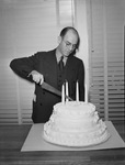 Marvin Leonard cutting cake