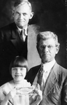 Reverend Scott W. Hickey at top, Walter (Money) Jones at right, and little Ernestine Hickey holding $10,000 bill