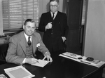 Clay J. Berry (seated) member of the Fort Worth City Council and City Secretary E. S. Birdsong (right)