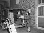 Red Cross workers loading blood plasma in a truck