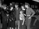 Lieutenant Colonel O. T. Forman being greeted by his family