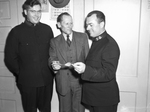 J. N. White, center, Carpenters' Union business agent, presenting check for Salvation Army to Major William T. Johnson