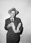 John Clough and some large sweet potatoes he grew in his victory garden
