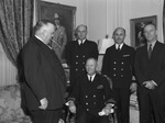 Left to right, Mayor I. N. McCrary, standing. Rear Admiral Percy W. Foote of Houston, seated. Standing behind him are Lieutenant Harold Banks of Dallas, Commissioner T.W. McDaniel, and H. Chester Walsh, Houston