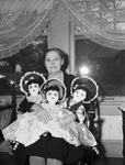 Mrs. Mary Altizer, 71, shown with dolls she made