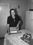 Mrs. A. J. Johnson wraps candy for service man