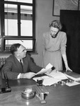 Erle L. Hardy, head of the Fourth Region, U. S. Weather Bureau, with his secretary, Marie Harris.