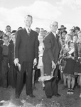 J. W. Warren, right, deacon of White Settlement Baptist Church, breaks ground for site of new Church building while Reverend Truman Aldredge, pastor, looks on