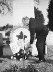 Charles C. Johnson Junior, placing wreath on tomb on Armistice Day