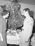 Sergeant Albert S. Powers Junior and Betty Jane Ford standing beside Christmas tree