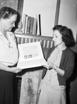 Mrs. Rudolph Kinney, acting librarian of Fort Worth Public Library, left, and Miss June Wasserman