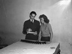 Jerry F. Smith, instructor in pre-factory drafting discusses lofting with a student, Miss Dorothy Smith