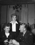 Captain Gene Raymond guest enlister for Women's Air Corps. Captain Gene Raymond, right, signs up Mrs. Claudia Crowell, left, and Mrs. Ila Mae Hunt