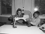 Berean Baptist Church. Toy repairing. Left to right, Billy Jetton, left, and James Bryan, mending toys