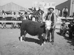 G. P. Mitchell with heifer by Frank Reeves Sr.