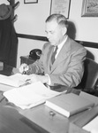 Doctor E. D. Head, president of Baptist Seminary at his desk