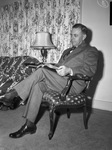 Doctor E. D. Head reading the Bible at his home at 2000 Broadus