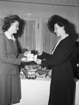 Miss Elizabeth Smith, left, and Miss Rowena Cummins, examining toys