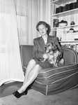 Miss Larraine Sherley, teacher of English and Art Appreciation at Texas Christian University (TCU), shown with her Cocker Spaniel