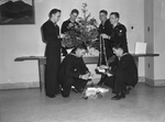 Navy corpsmen decorating for Christmas at Public Health Hospital