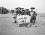 Shorty, with his blanket, mascot of the Sterling City High School. Jim Bob Clark, left, owner; Fred Mitchell and at right is Woodrow Mills all of Sterling City