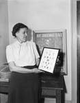 Sula Fleeman with collection of Christmas seals