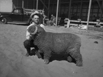 Odessa, Texas Sand Hills Livestock Show contestant Harry Swofford and his prize winning lamb by Frank Reeves Sr.