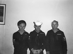 Bill Curd, 22, coxswain's mate in U. S. Coast Guard; R. L. Kilgore, 20, quartermaster second class, and Oran I. Oliphant, carpenter's mate second class