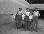 William Curtis Henderson, Arthur Edwards and James Henderson, all of Burkett High School, with Hereford calves by Frank Reeves Sr.