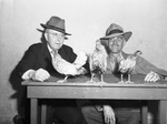 Dr. W. R. McCuistion and William W. Barker with birds for exhibit