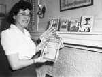 Sylvia Feneglio holding war bonds