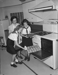 Camp Fire Girls baking cookies