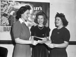 Riverside Assembly of Rainbow Girls. Virginia Albreacht and Naomi Myers receiving bond from Miss Ruby George Trussell of the First National Bank