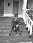 Private First Class Raymond Pettis shown with his dog