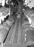 Neuro-psychiatric patients brought to Fort Worth, Texas from California. Inside of C-47 shows three tiers of stretching on each side.