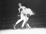Golden Gloves. Action. Horace Williams, left, of Rio Vista and Private Frank Michalski of Fort Worth AAF.