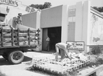 Waste Paper Collection: Pangburn Company workers loading waste paper from their collection depot