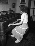 Weather station. Mrs. Louis Reid at piano