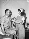 Blood Donor mobile unit Camp Wolters. Lieutenant Colonel Walter R. Linn and Mrs. Elizabeth Austin, nurse's aide
