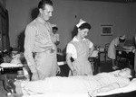 Blood Donor Mobile Unit. Mineral Wells, Texas. Lieutenant Philip R. Heise and Mrs. J. M. Mills talking to Mrs. Eston Ford