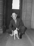 Dusty Rhodes and dog, "Invasia," mascot of the city jail