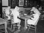 Red Cross Surgical dressing department. Mrs. Jack Stringfellow and Mrs. C. P. Hines folding bandages