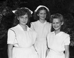 Members of Troop 19 who received Junior Office of Civil Defense caps. Cathie McConnell, Anna Belle Wright and Delores Wright