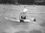Red Cross swimming classes. Mrs. Earl Almy, instructor, teaching Jackie Maurice Laves to float