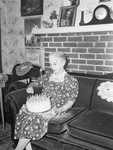 Mrs. C. C. Prator, 90 year old woman, holding her birthday cake