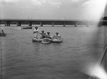 Fifth War Loan. Justice Chamber of Commerce "suicide squad". Paul Kautz, Justice Chamber of Commerce president, standing, while on the other rafts are Chic Snider, Dan Gould, Junior and Joe Pieringer