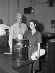 Absentee ballots. First Lieutenant Milton Coffey and wife, casting votes